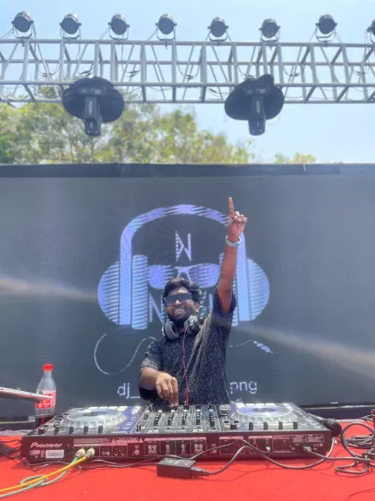 An outdoor daytime event with a full stage setup. Whether it's day or night, I'm ready to get the party started with my open format music selection.