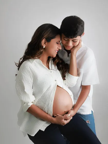 The color version of this beautiful moment between mother and son. The warmth of the photo matches the warmth of their growing family's love.