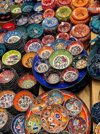 A vibrant display of traditional Turkish ceramics. I am obsessed with the rich colors and handcrafted patterns of this ancient art form, and I'm always looking for ways to incorporate such beautiful, functional pieces into my designs.
