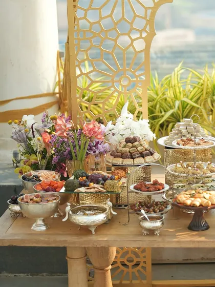 Another angle of the magnificent Iftaar spread, showcasing the towers of baklava and other traditional sweets.