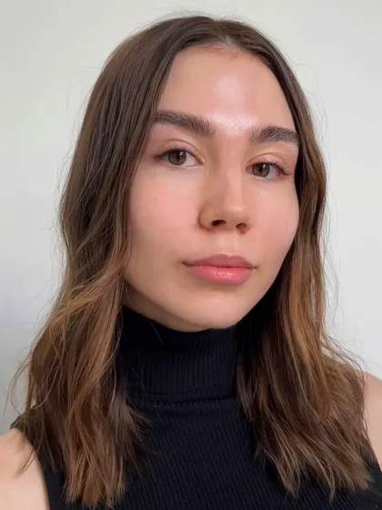 A slightly different angle of the same classic dark brown extensions. The result is subtle, elegant, and enhances her natural beauty without being obvious.