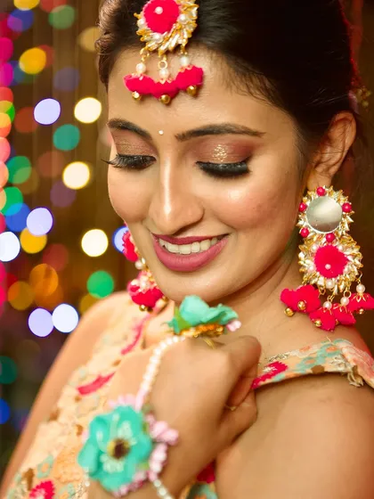 My beautiful client smiling, with a lovely bokeh background that makes her glow. The subtle makeup enhances her features, making her look effortlessly beautiful.