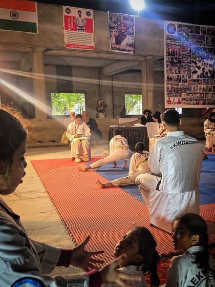 The atmosphere at our 4th Inter-Dojo championship, with students performing and others watching intently.
