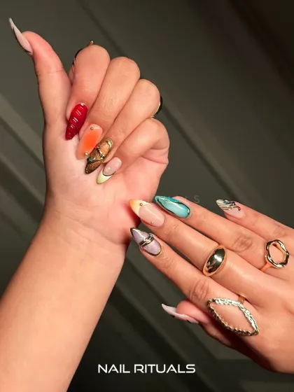 A different story on every finger. This image shows the full, colorful set of abstract nails, proving that your manicure can be a true form of self-expression.