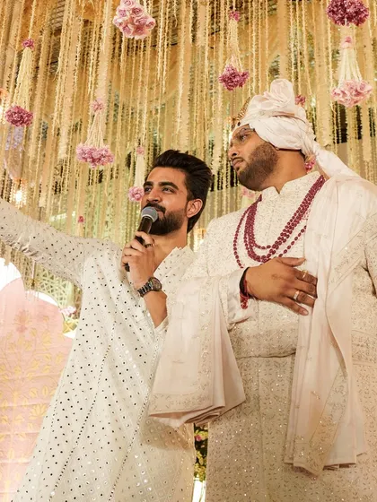 Sharing a moment with the groom before his grand entrance. I'm there to offer support and a bit of hype before the big moments.