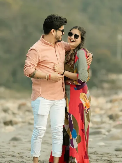 A candid and playful moment between a couple on the riverbank in Rishikesh. Capturing your genuine laughter and connection is what my photography is all about.