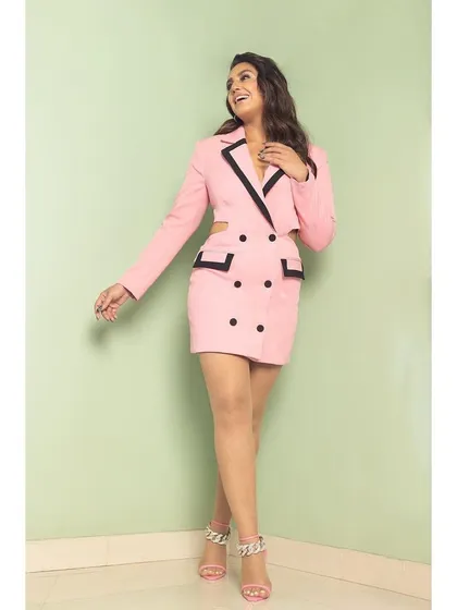 A happy, candid shot in the pink blazer dress, showing it's as fun as it is stylish.