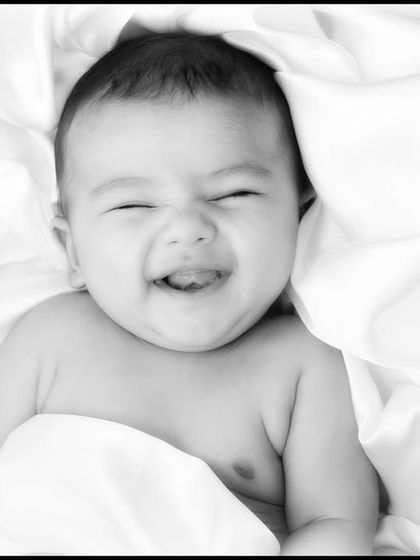 A heart-melting baby smile. While many newborn shots are peaceful and sleepy, I'm always ready to capture those fleeting, joyful expressions when they happen.