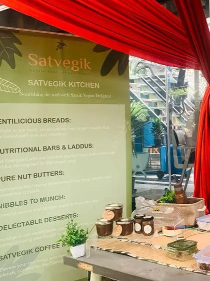 My stall at a local farmers market, showcasing my range of lentil breads, nutritional bars, and pure nut butters. I love these events for the chance to meet customers in person.