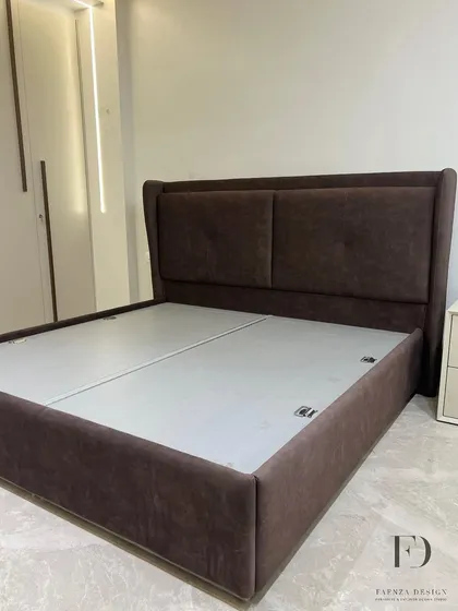 A custom bed with a winged, two-panel headboard in a rich brown fabric. The subtle tufting adds a touch of classic detail to this otherwise modern and comfortable design.