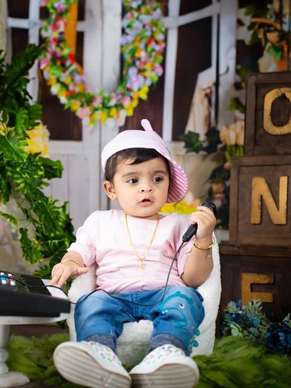 A little rockstar on the phone, maybe booking his next gig? A fun and playful shot from a musical theme.