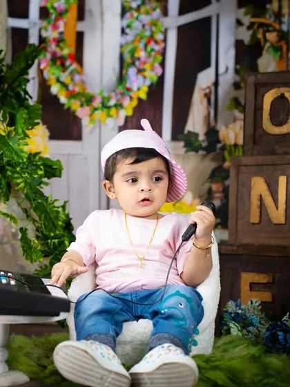A little rockstar on the phone, maybe booking his next gig? A fun and playful shot from a musical theme.