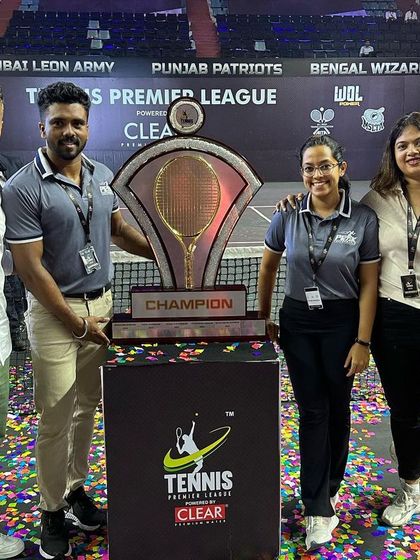 Posing with the Tennis Premier League championship trophy. These moments are a testament to the hard work of the athletes and the entire support team, including our dedicated physios.