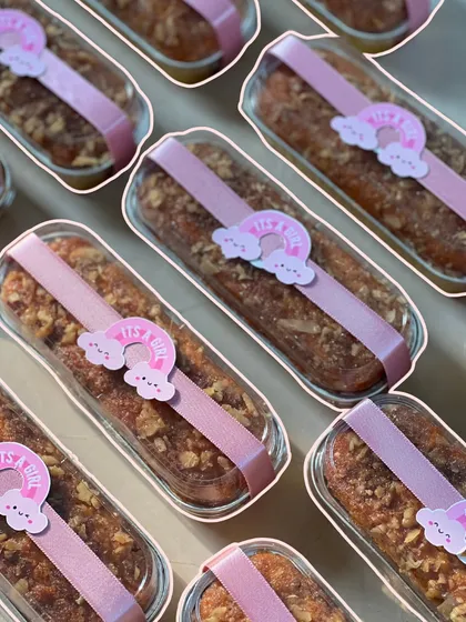 These delicious tea cakes were wrapped and decorated with a pink ribbon and an 'It's a Girl!' rainbow sticker.