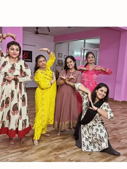 A group pose showcasing the grace and elegance learned during the semi-classical workshop.