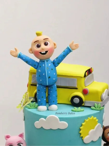 A close-up of the hand-sculpted JJ figurine from the Cocomelon cake.