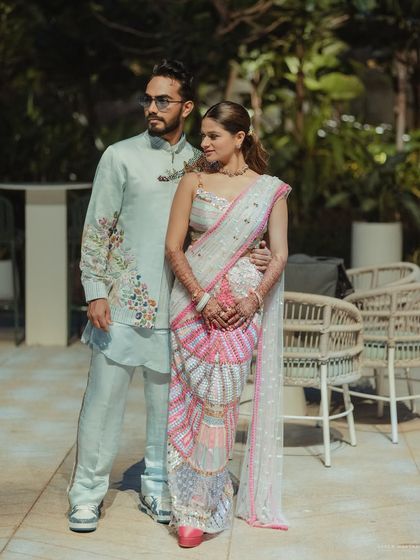 A stylish portrait of the couple. Her fun ponytail and fresh makeup are perfect for a daytime carnival.