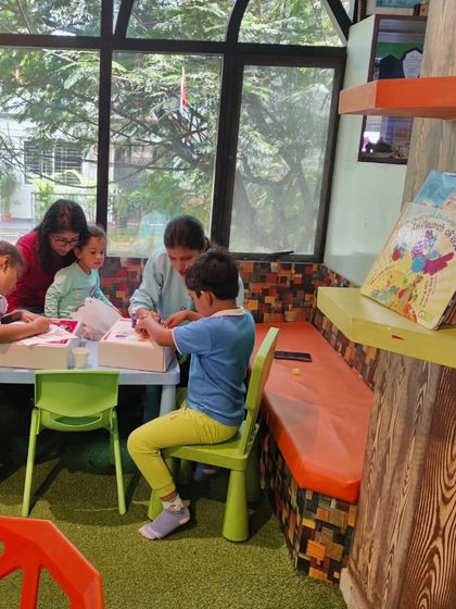Children engaged in a group craft activity during our Dusshera camp, learning and creating together in our bright and welcoming space.