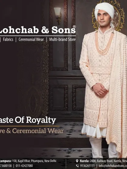 This full-length view showcases the elegant drape and silhouette of our festive and ceremonial wear. The ivory sherwani, with its detailed fabric and matching stole, is designed to create a look of understated royalty, perfect for any grand celebration.