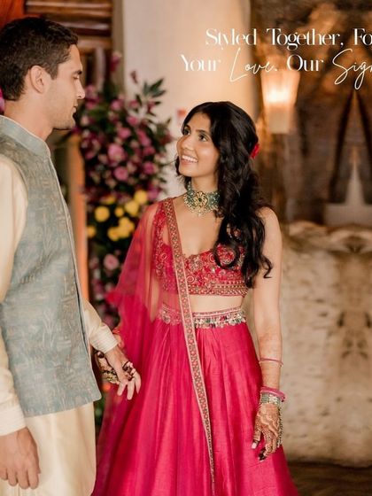 Styled together, forever. For their Sangeet in Costa Rica, we paired a vibrant fuchsia Ridhima Mehra lehenga with a subtle, elegant Nehru jacket look from Lalit Laungani, creating a beautiful contrast that celebrated their joy.