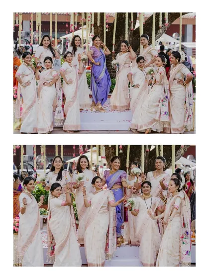 A group portrait of a Maharashtrian bride with her bridesmaids, who are all dressed in elegant matching white and pink sarees.