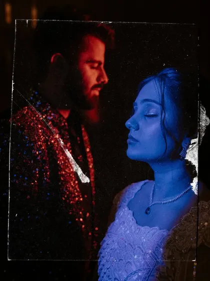 An experimental double exposure portrait using red and blue light, turning a Sangeet photo into a piece of abstract art.