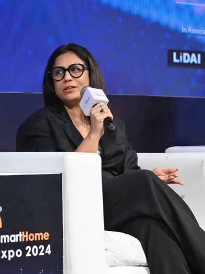 A seasoned professional contributes her valuable insights during a panel discussion on smart home technology.