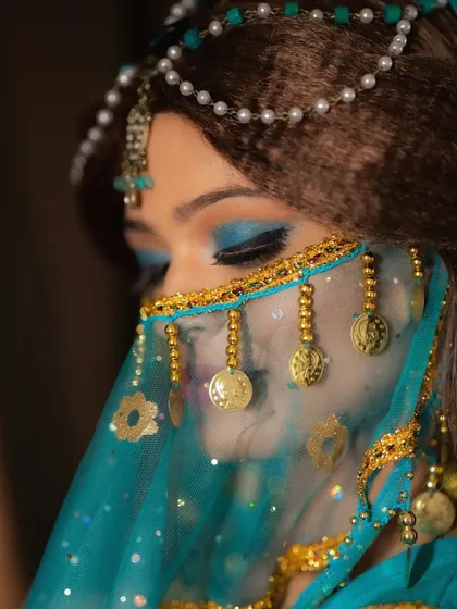 A close-up of my Princess Jasmine cosplay makeup. The focus is on the vibrant turquoise eyeshadow with a sharp winged liner, capturing the iconic look of the character while adding a touch of glamour.