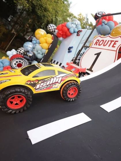 A close-up of the race track ramp, a fun and interactive element of the party decor.