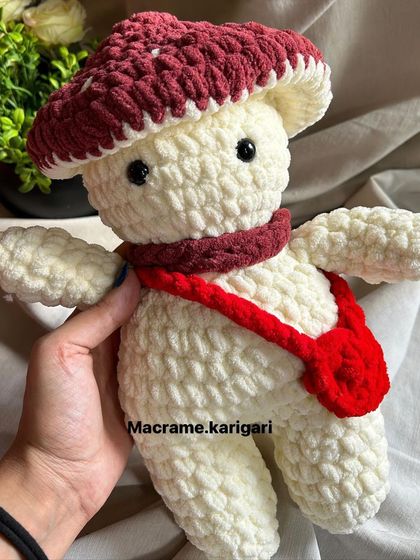 A close-up of the mushroom toy, showing the detailed stitching. We take pride in the quality and craftsmanship of every plushie we create.