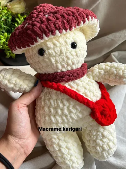 A close-up of the mushroom toy, showing the detailed stitching. We take pride in the quality and craftsmanship of every plushie we create.