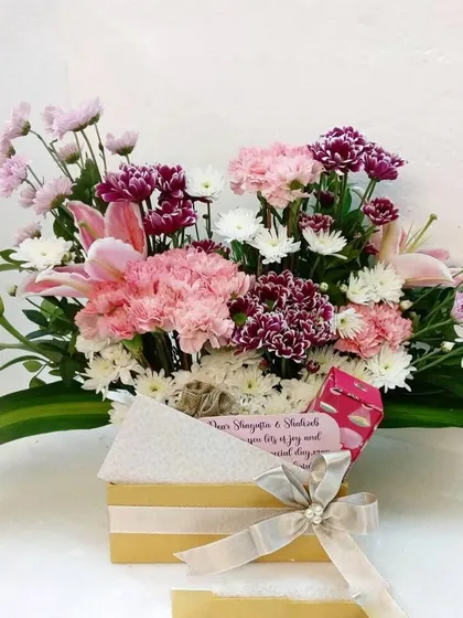 Mother's Day blooms in a box. A simple yet beautiful arrangement of fresh pink and white flowers, perfect for surprising the most important lady in your life.
