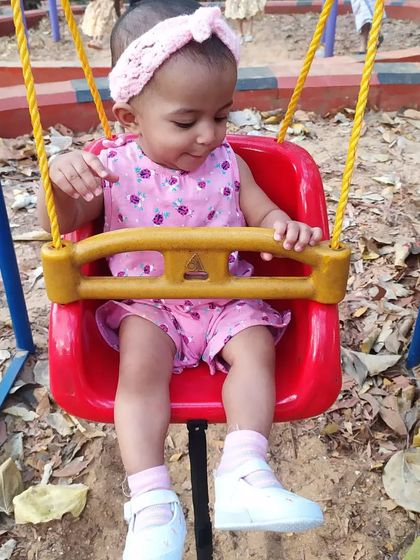 Even on the swings, the Candyline Summer Headband is a perfect accessory for a day at the park.