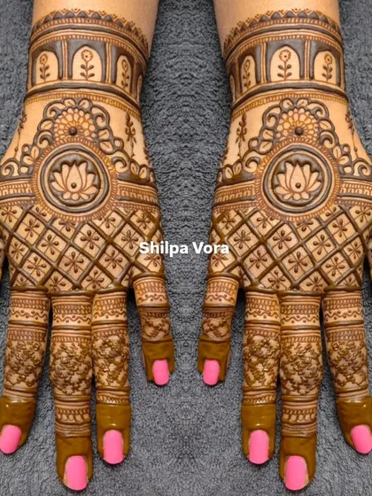 Symmetrical design with a central lotus mandala, surrounded by a classic 'jaal' or net pattern. The solid fingertips complete the traditional look.