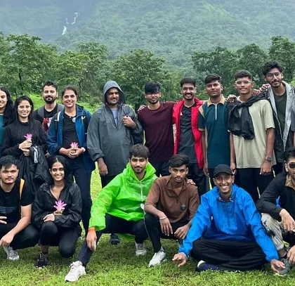 A large group of adventurers who joined us for the Kalu Waterfall trek in Maharashtra, ready to witness its monsoon power.