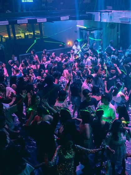 The dance floor at Hydra under cool blue and green lights. I adapt my lighting and music to create different moods throughout the night.