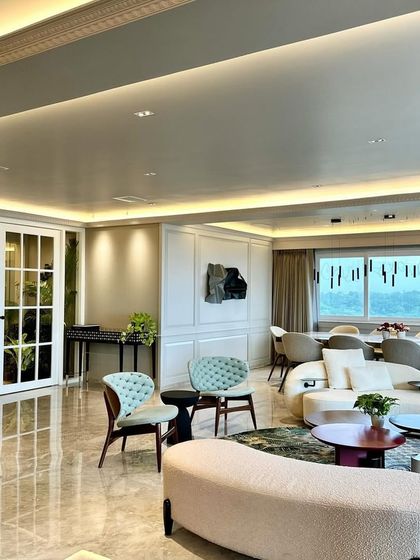 The open-plan living and dining area, where the sculpture is visible as a key feature of the home's design.