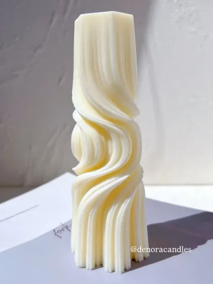 A front-on studio shot of the wave twisted pillar candle.