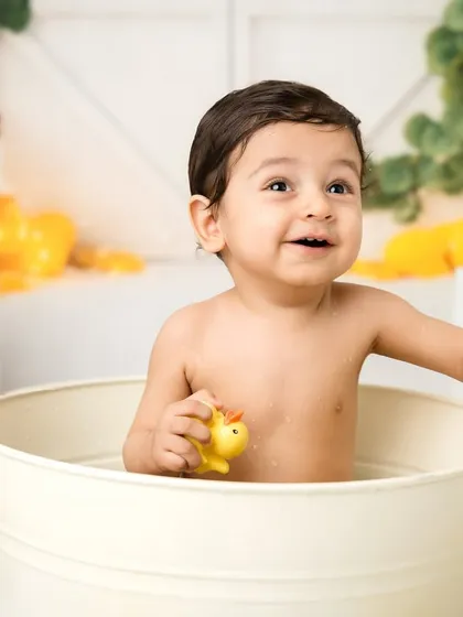 After the cake, it's time for a splash! This lemon and ducky themed bath is a fun way to clean up and get even more adorable photos.