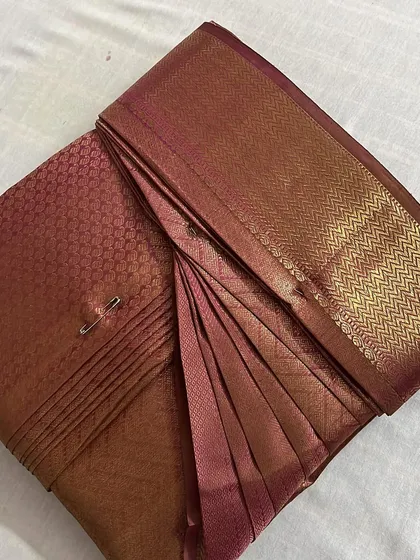 This is the result I aim for with every saree. The pleats are perfectly set, ironed, and pinned, making it incredibly easy for you to drape. This rich silk saree is now ready for any grand occasion, completely stress-free.