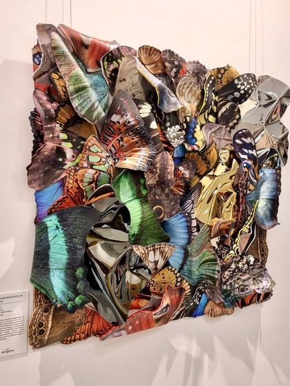 This butterfly installation, with its earthy green and brown tones, is a tribute to our planet's vibrant biodiversity.