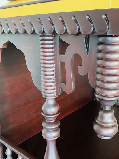 A detail shot of the turned and fluted pillars of a wooden puja unit. No machine can replace the heart and soul my artisans put into their work, and it shows in these intricate details.
