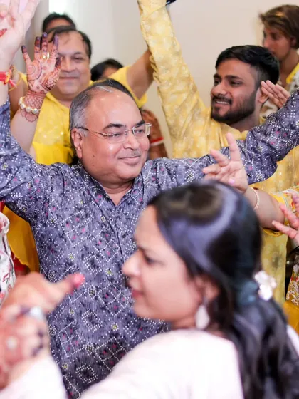 A candid shot of wedding guests dancing with abandon. I love capturing the uninhibited joy on the dance floor.