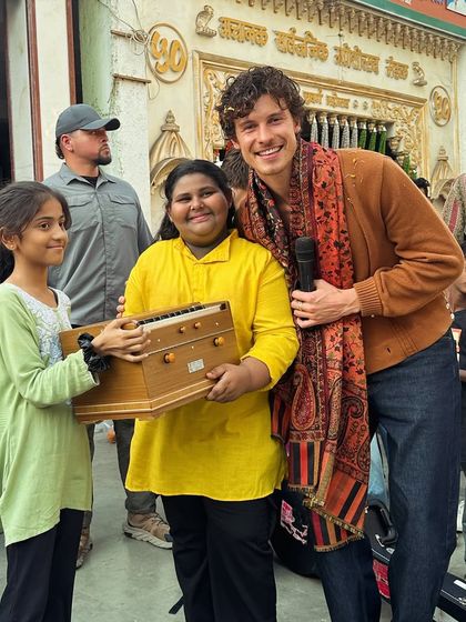A beautiful moment of connection as two of our students present a handcrafted harmonium to Shawn Mendes. This gift represents a piece of India's rich musical heritage.