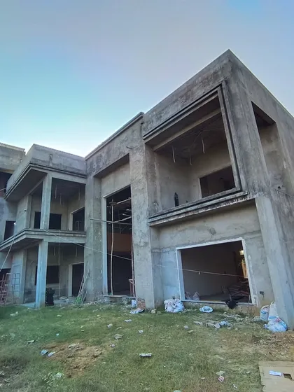 Another angle of the Moradabad villa during construction, showcasing the large openings and the interplay of different structural volumes that will define the home's character.