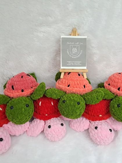 A lineup of my fruit-themed plush turtles, including strawberry and watermelon designs.