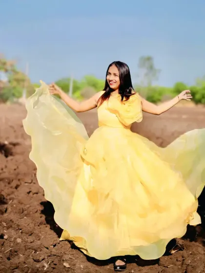 Our yellow organza gown looks stunning in the sunlight, bringing a cheerful and vibrant energy to this outdoor pre-wedding shoot.