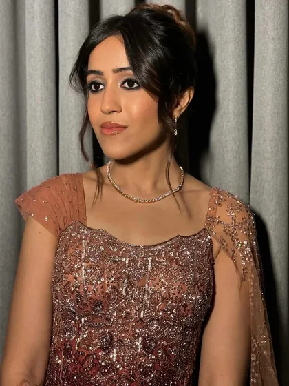 Another angle of the soft smokey eye and French twist updo. The perfect balance of elegance and glam for a sangeet or cocktail party.
