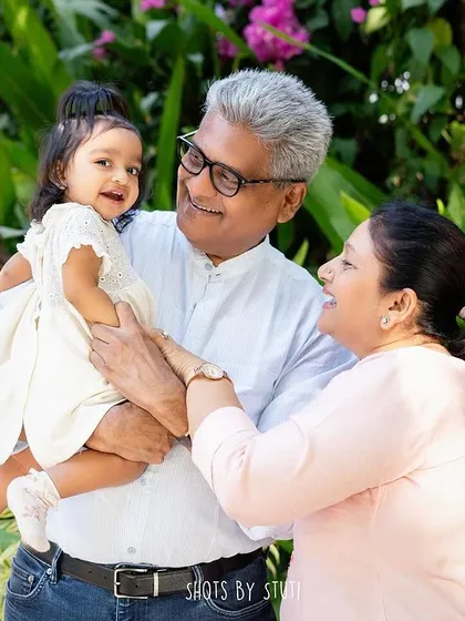 A portrait with grandparents is a treasure. The pride and love in their eyes as they hold their granddaughter is a beautiful story of legacy and family.