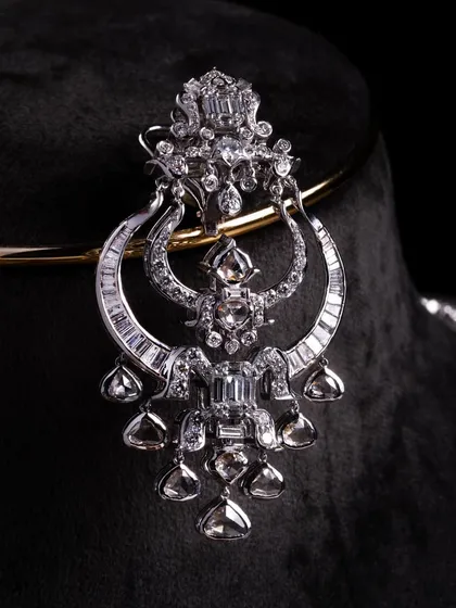 The Celeste Radiance set is for the modern bride who wants impact without heaviness. We designed this with a clean line of mixed diamond cuts, including structured baguettes and soft rounds, finished with fluid drop detailing that moves when you do. It’s sharp, balanced, and unapologetically elegant.